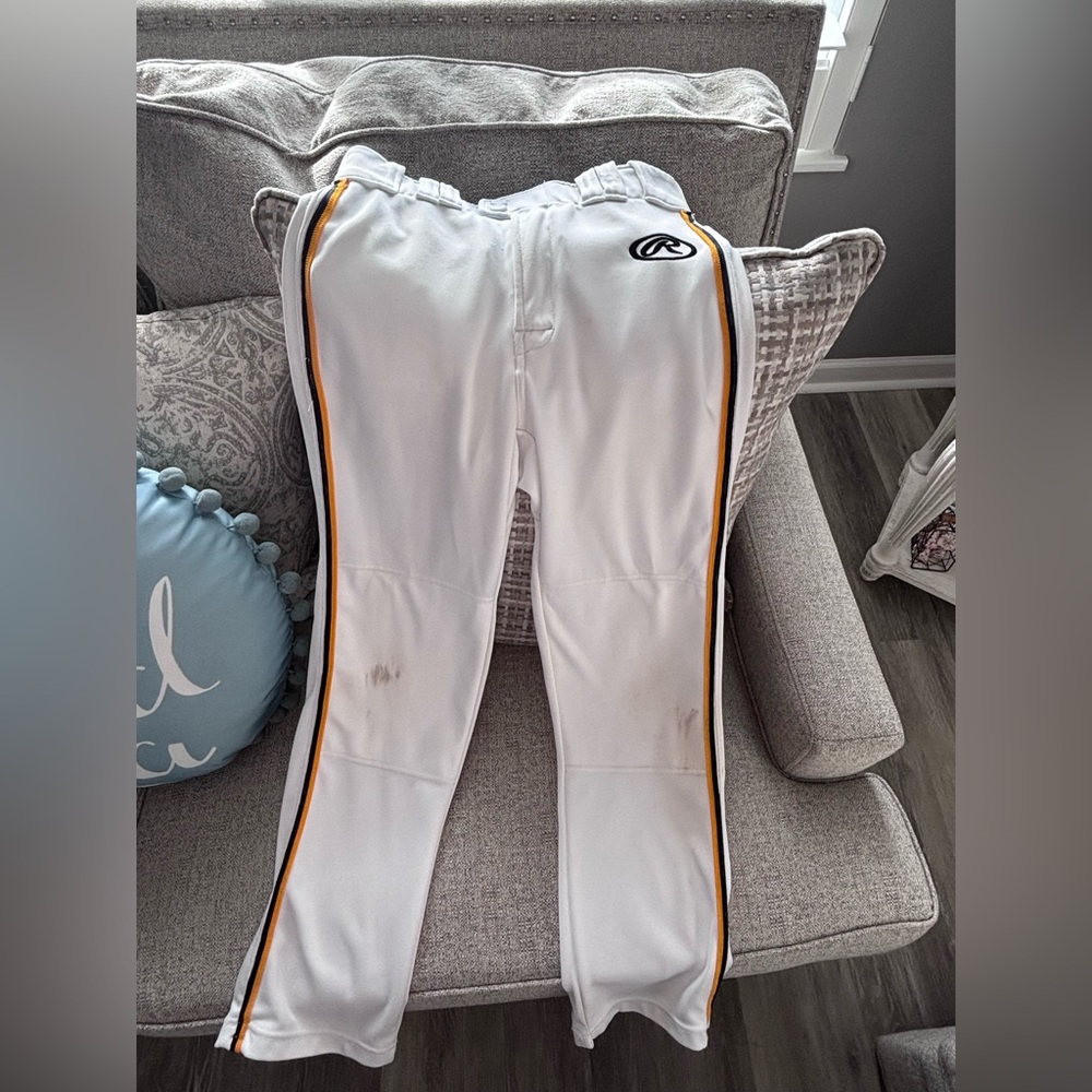 Rawlings boys size L baseball pants. White with blue and yellow stripe.